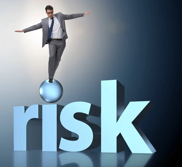 Young businessman in business risk and uncertainty concept — Stock Photo, Image