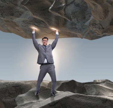 Baskı altında taşı destekleyen iş adamı