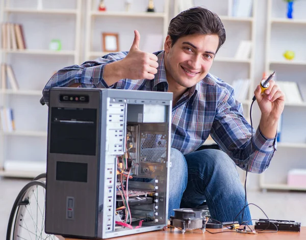 Man repairing pc with thumbs up