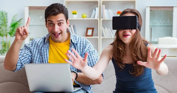 Young family playing games with virtual reality glasses — Stock Photo, Image