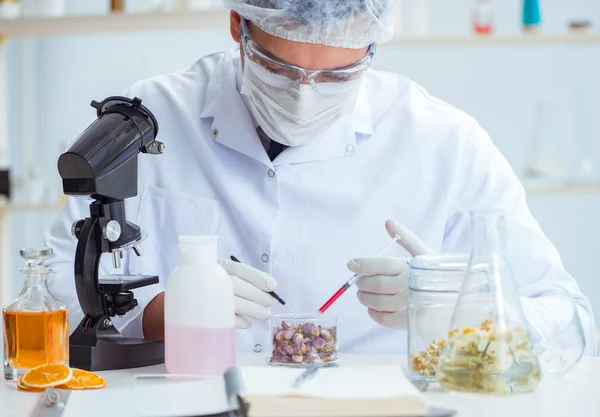 Chemist mixing perfumes in the lab