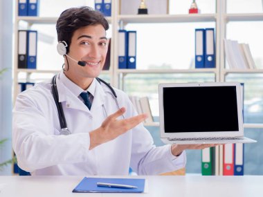 Young male doctor in telehealth concept clipart