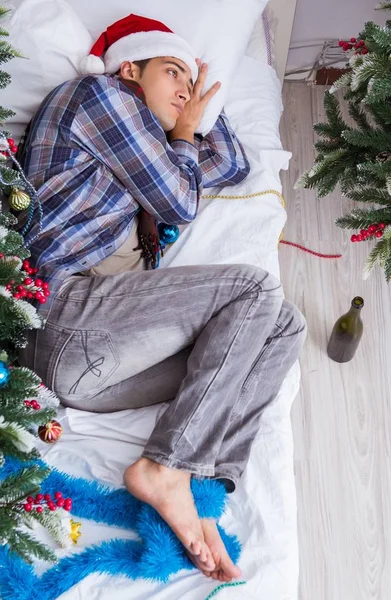 Man suffering hangover after christmas party — Stock Photo, Image