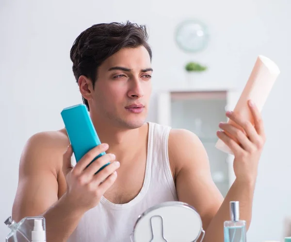 Young handsome man staring in the mirror — Stock Photo, Image