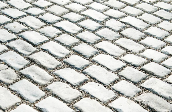 Camino pavimentado con piedras de guijarro para su fondo — Foto de Stock