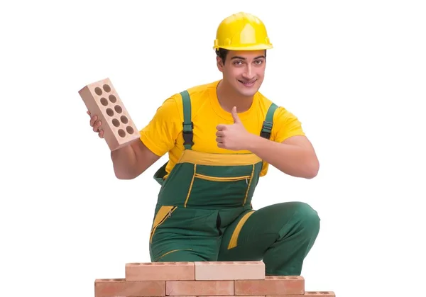 The handsome construction worker building brick wall — Stock Photo, Image