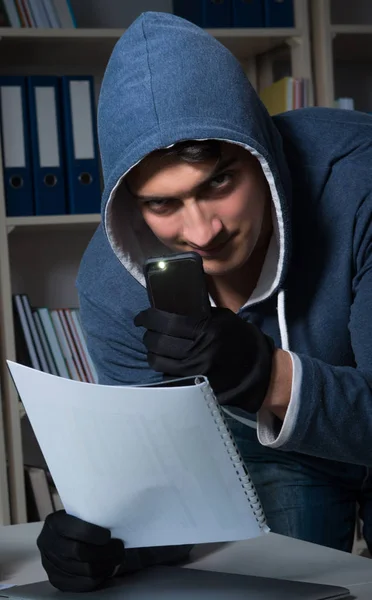 Young man in industrial espionage concept — Stock Photo, Image