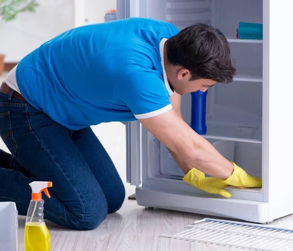 Man cleaning fridge in hygiene concept — Stock Photo, Image