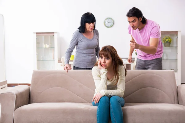 Young family and mother-in-law in family issues concept — Stock Photo, Image