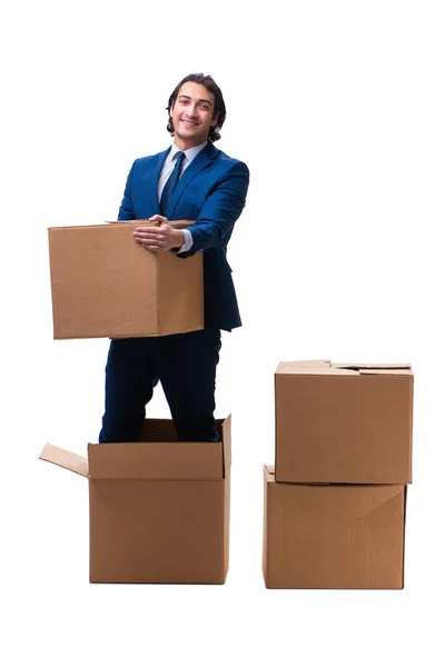 Młody pracownik płci męskiej z pudełkami izolowanymi na białym — Zdjęcie stockowe