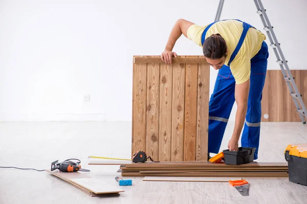 Young male contractor working indoors — Stock Photo, Image