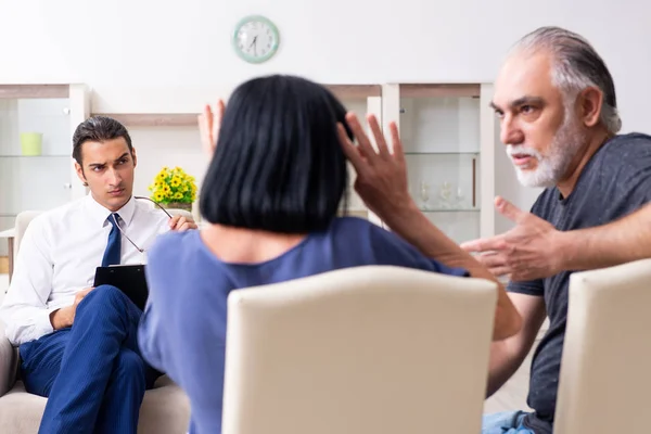 Old couple visiting psychiatrist doctor