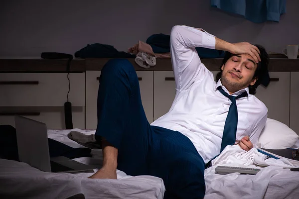 Young employee working at home after night shift — Stock Photo, Image