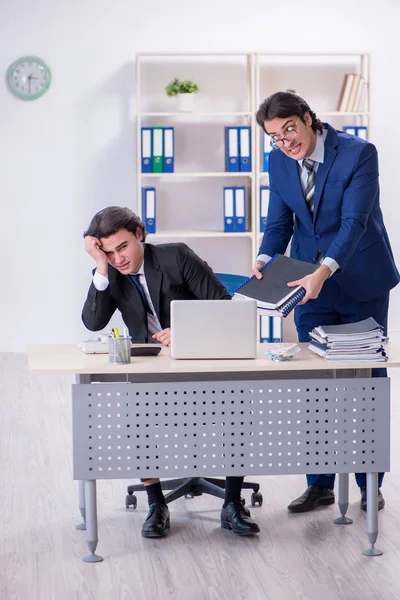 Boss and his male assistant working in the office — Stock Photo, Image