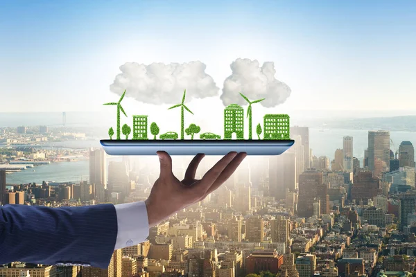 Hand holding tablet with mini ecosystem and clean energy — Stock Photo, Image