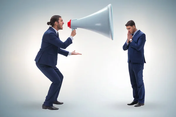 Businessman shouting through large loudspeaker — Stock Photo, Image