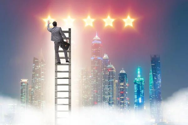 Businessman reaching out for stars — Stock Photo, Image