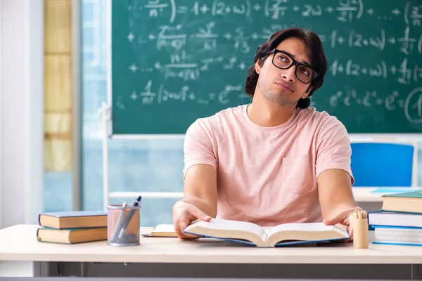 Young male student in the classroom — Stock Photo, Image