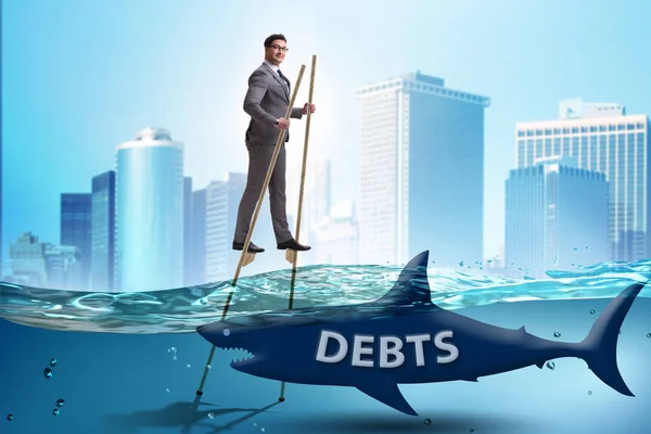 Zakenman succesvol omgaan met leningen en schulden — Stockfoto