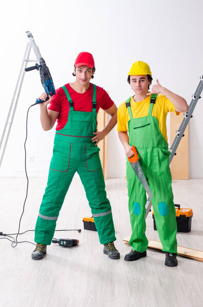 Two workers contractors working indoors