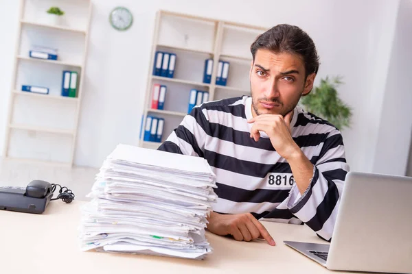 Young employee feeling like prisoner at work — Stock Photo, Image