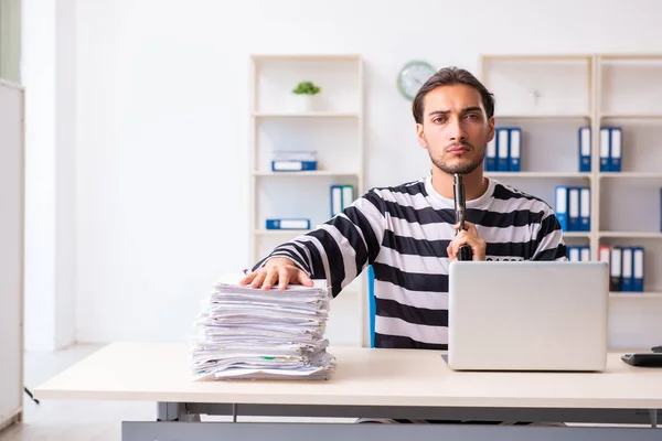 Young employee feeling like prisoner at work — Stock Photo, Image