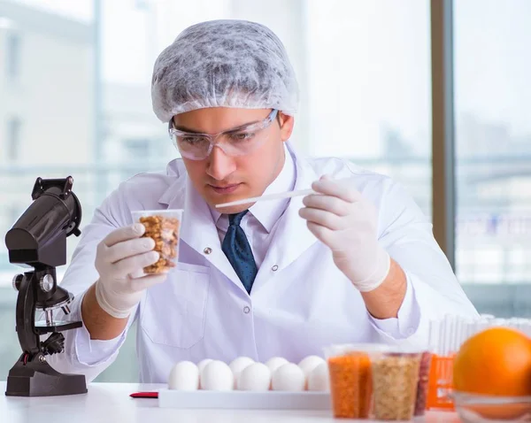 Nutrition expert testing food products in lab Stock Image