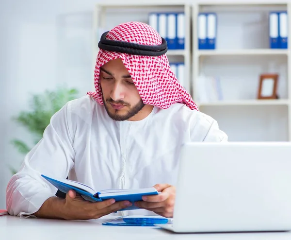 Arab businessman working in the office doing paperwork with a pi — Stock Photo, Image