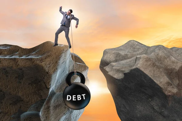 Concept of debt and load with businessman — Stock Photo, Image