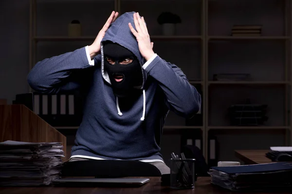 Male thief in balaclava in the office night time — Stock Photo, Image