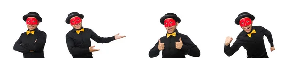 Jeune homme en costume noir et masque rouge isolé sur blanc — Photo