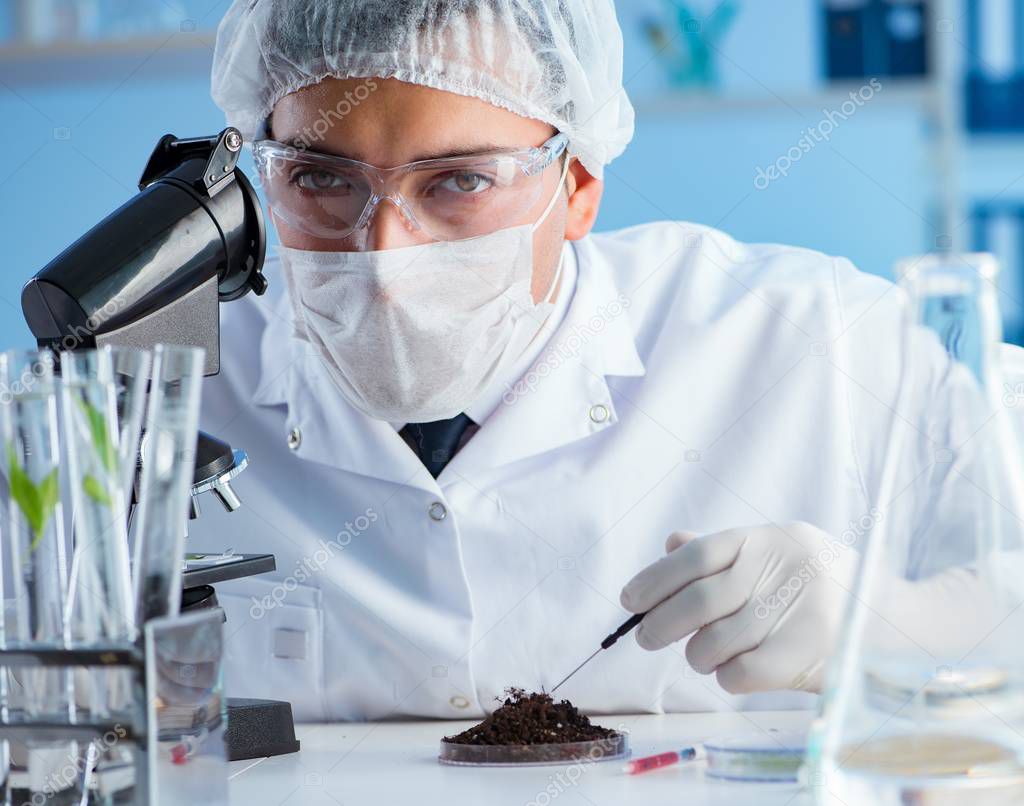 Male scientist researcher doing experiment in a laboratory