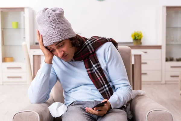 Young man suffering from flu at home — Stock Photo, Image