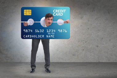 Businessman in credit card burden concept in pillory clipart