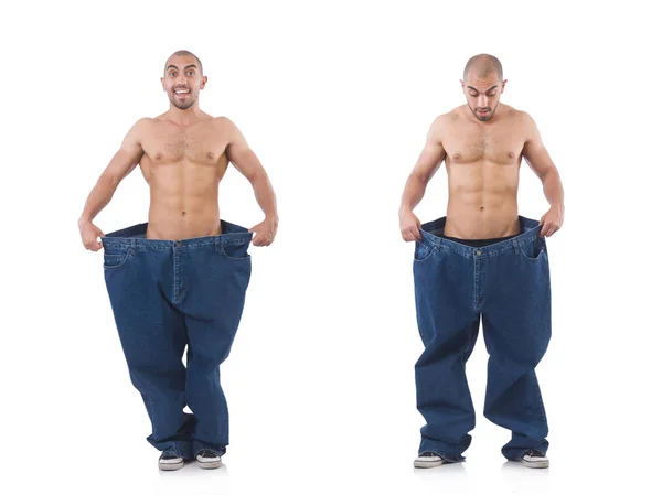 Homem em dieta conceito com jeans de grandes dimensões — Fotografia de Stock