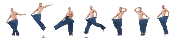 Mann im Diätkonzept mit übergroßen Jeans — Stockfoto