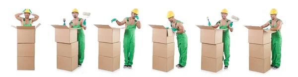Man in green coveralls with boxes — Stock Photo, Image