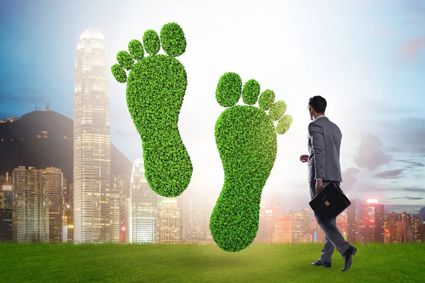 Carbon footprint concept with businessman — 스톡 사진