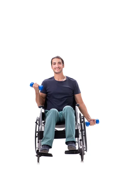 Mladý zdravotně postižený muž dělá fyzická cvičení izolované na bílém — Stock fotografie
