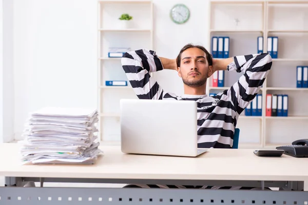 Young employee feeling like prisoner at work — Stock Photo, Image