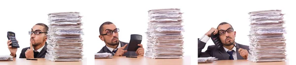 Angry businessman with stack of papers — Stock Photo, Image