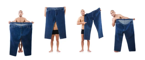 节食概念与超大牛仔裤的男人 — 图库照片