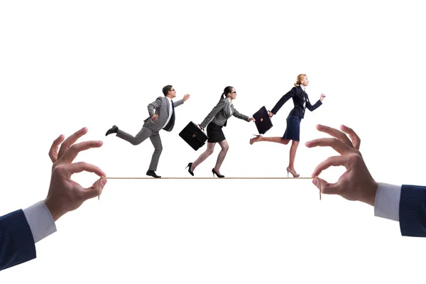 Business people walking on tight rope — Stock Photo, Image