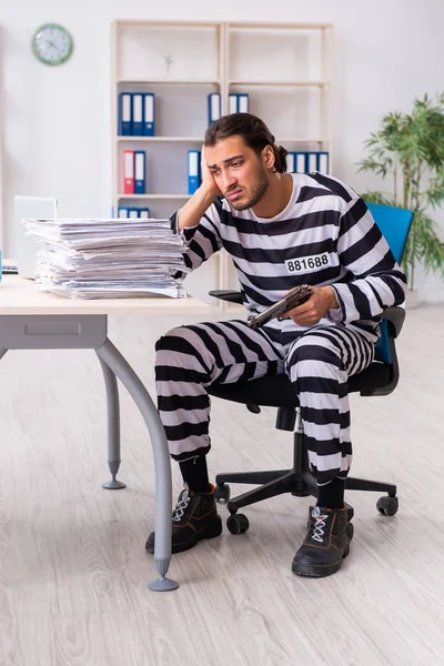 Young employee feeling like prisoner at work — Stock Photo, Image