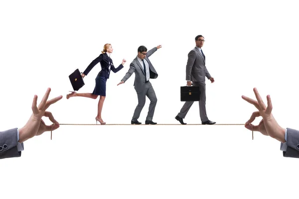 Business people walking on tight rope — Stock Photo, Image