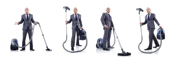 Businessman doing vacuum cleaning on white — Stock Photo, Image