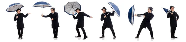 Молодой человек с зонтиком, изолированным на белом — стоковое фото