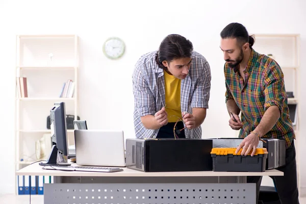 IT engineers working on hardware issue