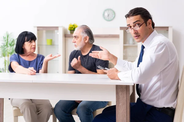 Financial advisor giving retirement advice to old couple