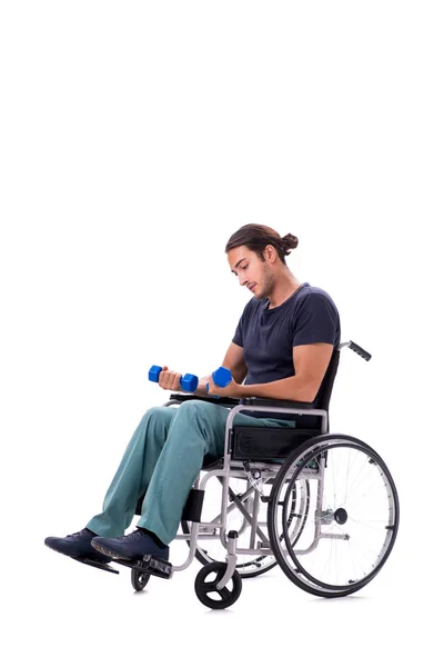 Young disabled man doing physical exercises isolated on white — Stock Photo, Image